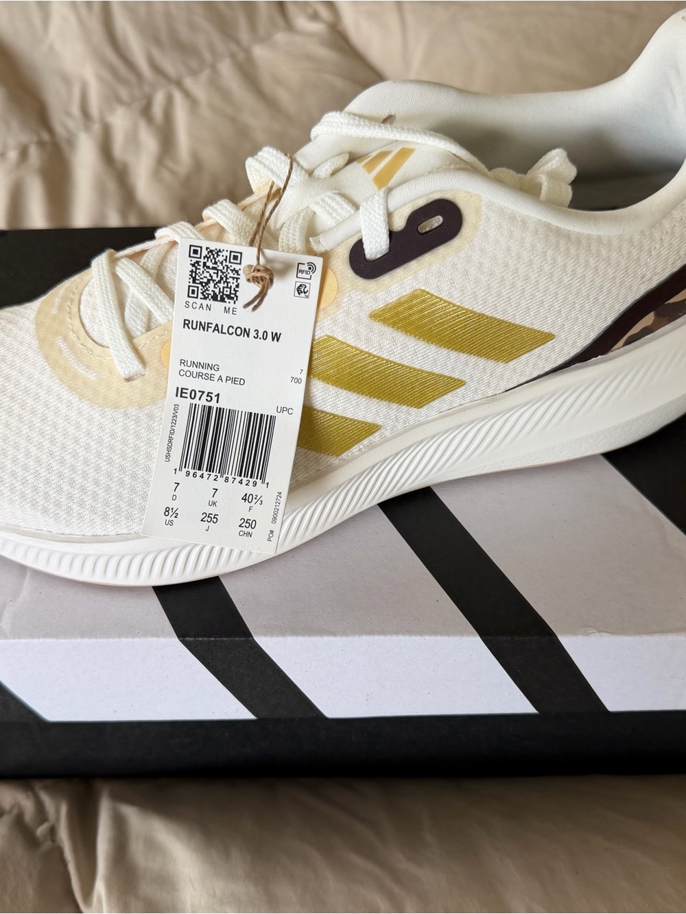 adidas White Sneakers with Gold Three-Stripes Accent